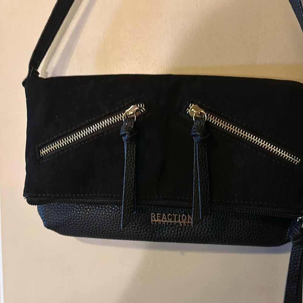 Black suede /pebble finish shoulder clutch opens from top/side zippers on front
